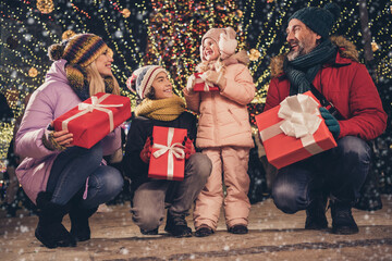 Wall Mural - Portrait of attractive cheerful big full family strolling traveling spending December gathering generation sharing gifts city urban outdoors