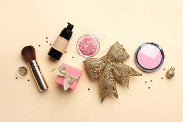 Canvas Print - Flat lay composition with makeup products and Christmas decor on beige background