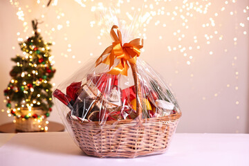 Poster - Wicker gift basket with wine on white table