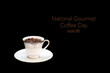 © Luis G. Vergara - Cup full of coffee beans on black background with a script on top: 'National Gourmet Coffee Day'