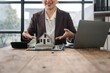 © Kritdanai - Real Estate Agent Presenting Home Model: A friendly real estate agent with a warm smile presents a miniature house model to a potential buyer.