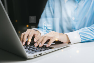 Poster - Close-up of hands typing on a laptop, showcasing digital documents and multitasking in a professional setting.