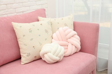 Poster - Soft decorative pillows on pink sofa indoors