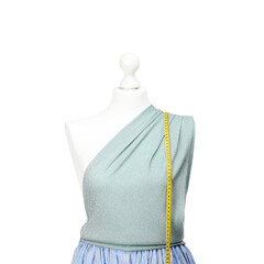 Canvas Print - Mannequin with skirt, shirt and measuring tape isolated on white. Creating new outfit