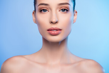 Portrait of stunning lady look having soft smooth face skin isolated blue color background