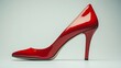 © lara - A single red high heel shoe with a pointed toe is isolated against a white background.