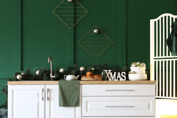 Sticker - White kitchen counter with Christmas decor near green wall