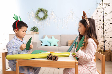 Sticker - Cute little children creating Christmas decor at home