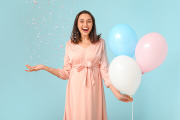 Poster - Beautiful happy pregnant woman with balloon and confetti on blue background. Gender reveal party concept