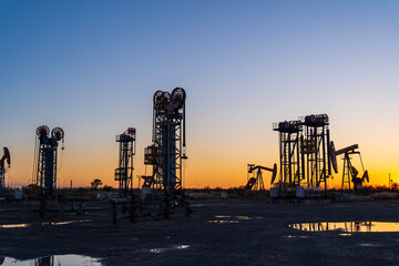 Wall Mural - oil drilling rig in the evening