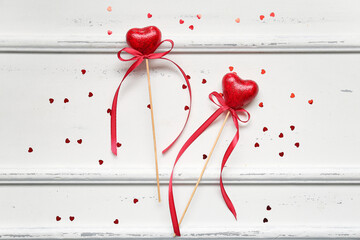 Wall Mural - Composition with red hearts for Valentine's Day on light wooden background