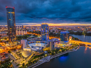 Yekaterinburg city and pond aerial panoramic view at summer or early autumn night. Night city in the early autumn or summer.