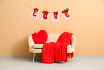 Poster - White sofa with heart-shaped cushion, red blanket and bunting near beige wall. Valentine's Day celebration