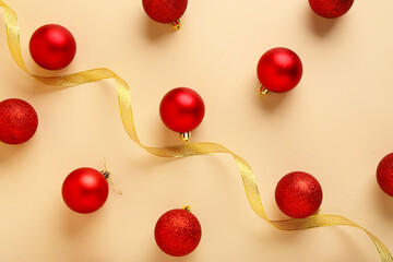 Wall Mural - Composition with beautiful Christmas balls and ribbon on color background