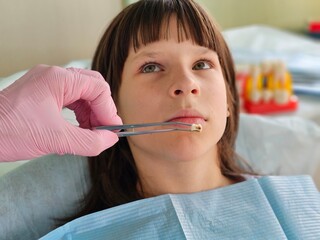 Child teenager girl undergoing dental treatment