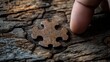 © Pixel Alchemist - Finger touches wooden puzzle piece on textured surface, focus on details.