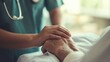 © santima - Caregiver holds elderly patient's hand.