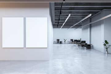 Poster - Modern coworking office interior with furniture and empty white mock up frames on wall. 3D Rendering.