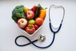 © abdulmoizjaangda - Heart shaped bowl of vegetables next to stethoscope symbolizes health