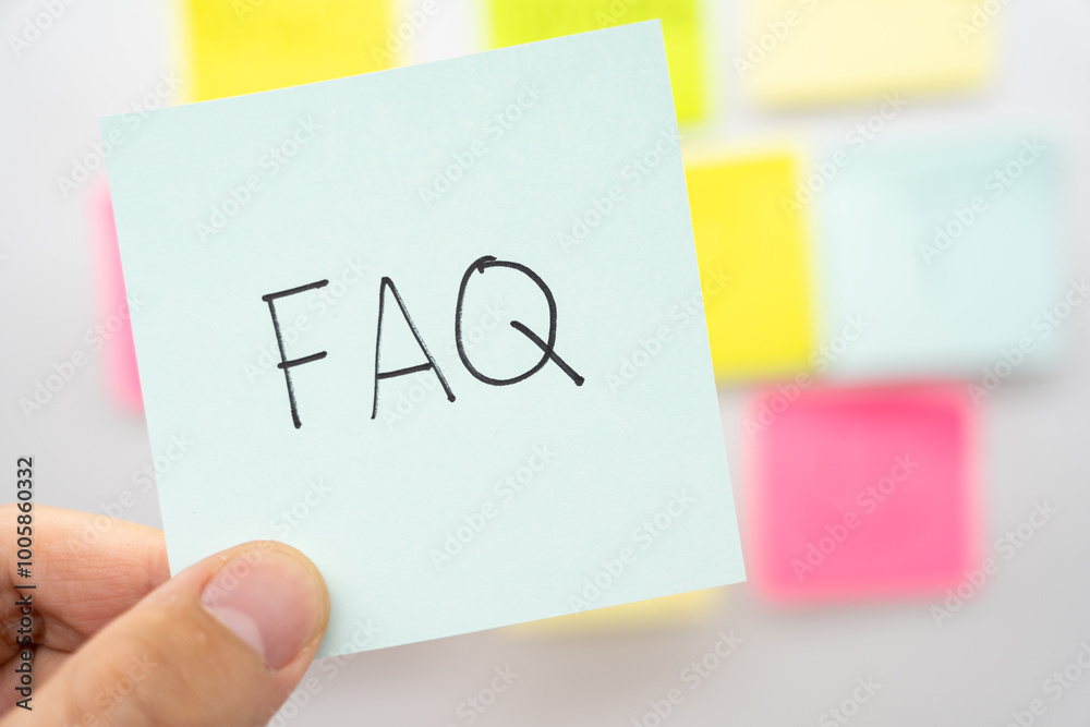 Fotografie FAQ text on light blue sticky note. FAQ is frequently asked ...