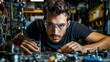 © Sasint - Portrait of a mechanical engineer assembling a prototype, detailed concentration, workshop environment filled with tools and machinery