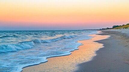 Sticker - Serene beach at sunset with gentle waves and colorful sky reflections.