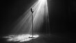 © BerkahStock - A solitary microphone stands under dramatic lighting on a stage, evoking a performance atmosphere.