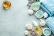 © syhin_stas - Skincare products and accessories are lying on a blue textured surface forming a relaxing background for a spa treatment