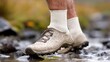 © Chaikit - 2409_121.a close-up of a personâ€™s foot in a drenched sock with visible fuzz, juxtaposed with damp, muddy shoes nearby, highlighting the potential for mold and irritation