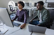 © ReeldealHD images - Students working together on a computer learning how to code