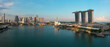 © Westend61 - Aerial view of Singapore's Marina Bay area with modern skyscrapers and waterfront.