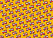 © Westend61 - Pattern of cartoon firetruck illustrations on a yellow background