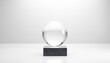 © Westend61 - Minimalist 3D rendering of a glass sphere on a marble base with a clean background.