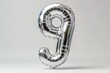 © Evon J - Silver Number 9 Balloon on a Neutral Background
