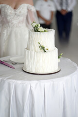 Wall Mural - White wedding cake decorated with flowers.