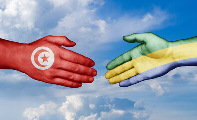 Gabon and Tunisia country handshaking with flags, consensus concept international co-operation illustration