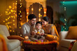 © Niks Ads - happy indian family celebrating diwali festival at home