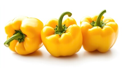 Yellow bell peppers on white backdrop, crisp texture, fresh vibrant colors, clean simple presentation.