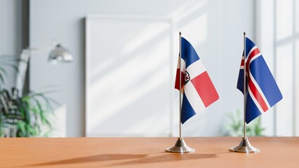 FLAGS OF DOMINICAN REPUBLIC AND ICELAND ON TABLE