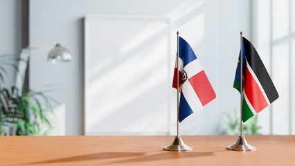 FLAGS OF DOMINICAN REPUBLIC AND SOUTH SUDAN ON TABLE