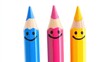 © Napasnan - A whimsical collection of three smiling pencils in bright hues, isolated against a clean white background, perfect for children art