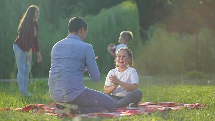 family picnic children outdoors. parents children enjoying food play nature. family picnic children 