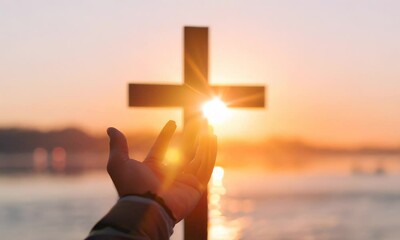 Wall Mural - a hand reaching out towards a wooden cross silhouetted against a vibrant sunrise, symbolizing faith 