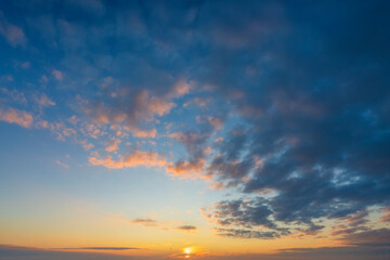 Wall Mural - glowing real sky at sunset texture background overlay. dramatic red and orange clouds.