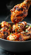 © nuupucca - Glazed chicken drumsticks with sesame garnish
