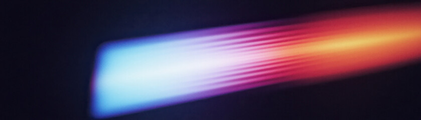 Poster - Abstract light streaks in vibrant colors creating a dynamic background. Ideal for modern designs, technology themes, or artistic projects.