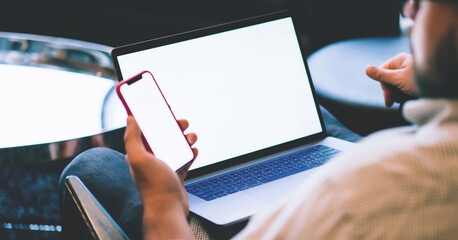 Fototapete - close up of young man holding smartphone with blank screen in hands, checking email box, business ma