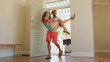 © Monkey Business - Man Carries Woman Over Threshold Of Honeymoon Or Holiday Rental