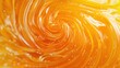 © Denis - abstract background, swirl of melted gooey mango gummy candy, extreme close up, aerial view