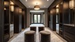 © keetazalay - Overhead shot of a contemporary dressing room featuring custom-made velvet ottomans sleek lighting fixtures and dark wood cabinetry
